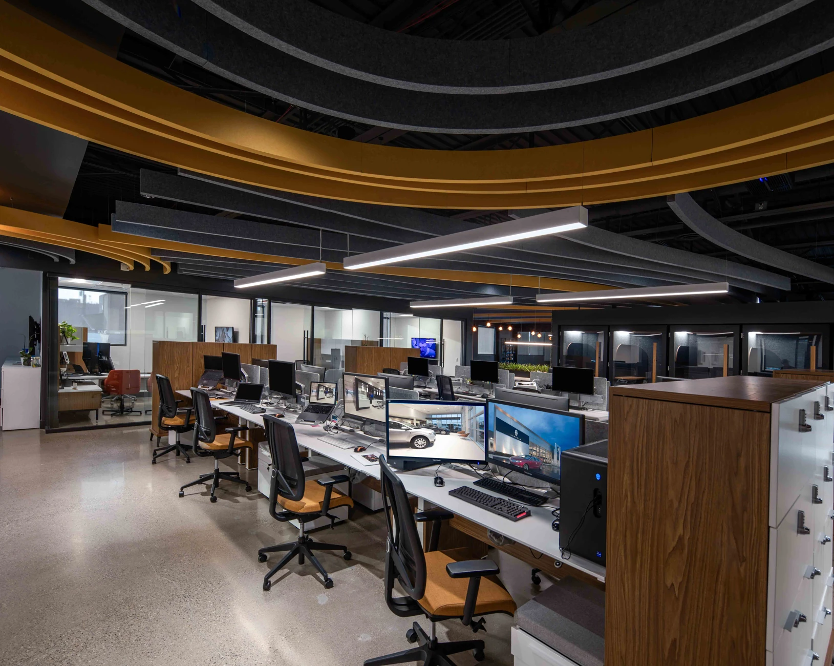 Open workstations beneath the sculptural ceiling at K5 Headquarters
