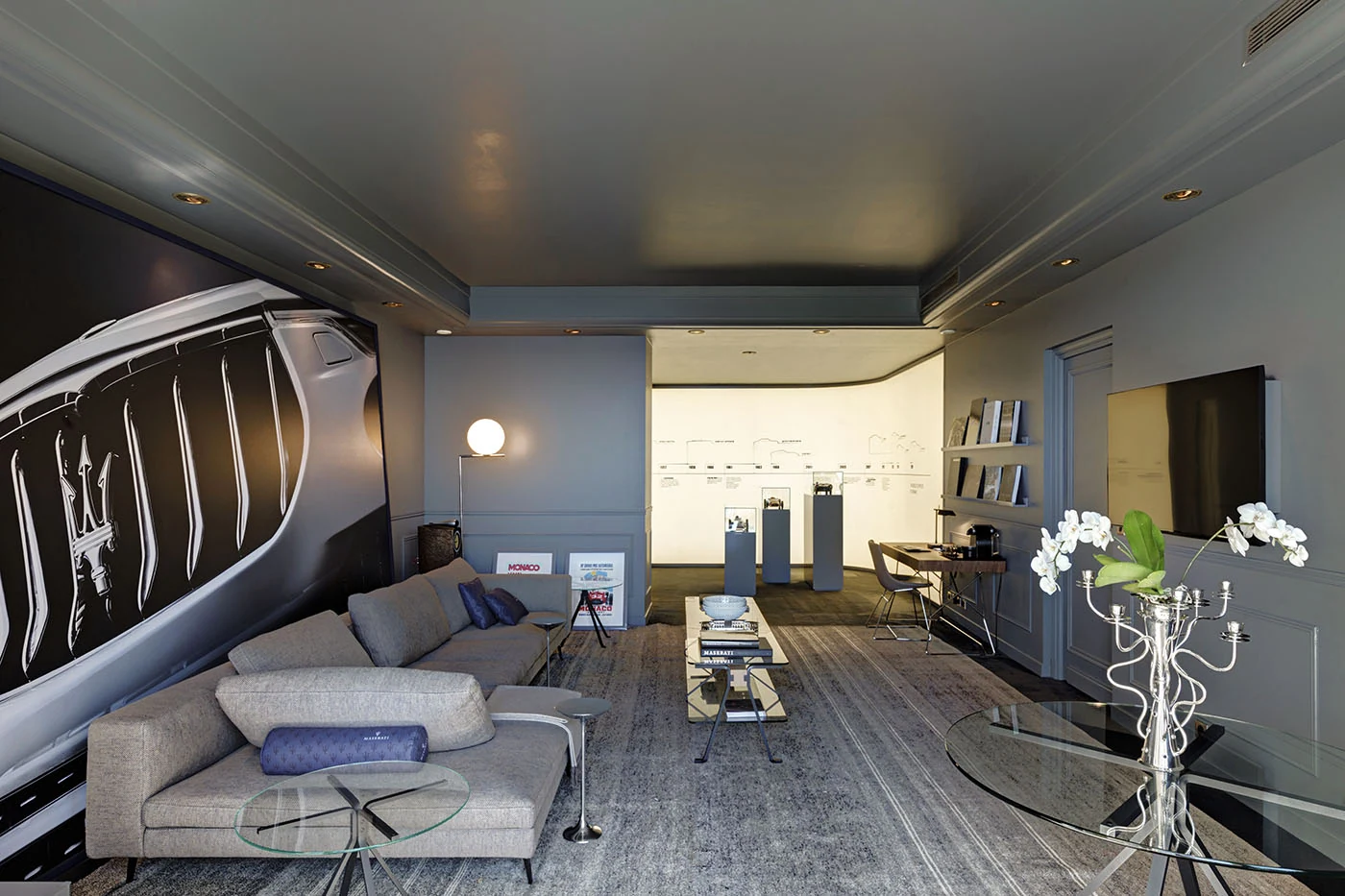 Maserati suite at Hôtel de Paris, Monte Carlo: the full lounge with a large grille graphic above the sofa