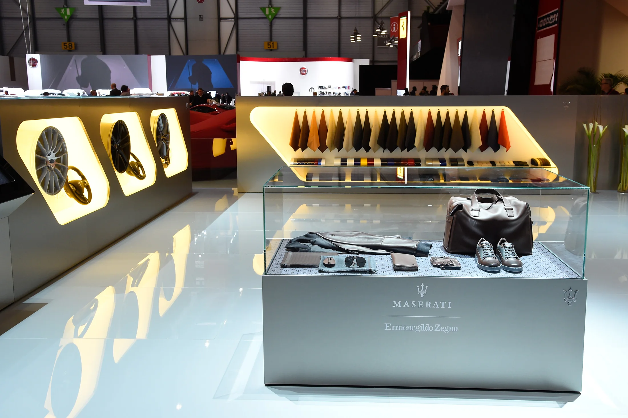 A material and accessory display makes the marque’s craftsmanship tangible.