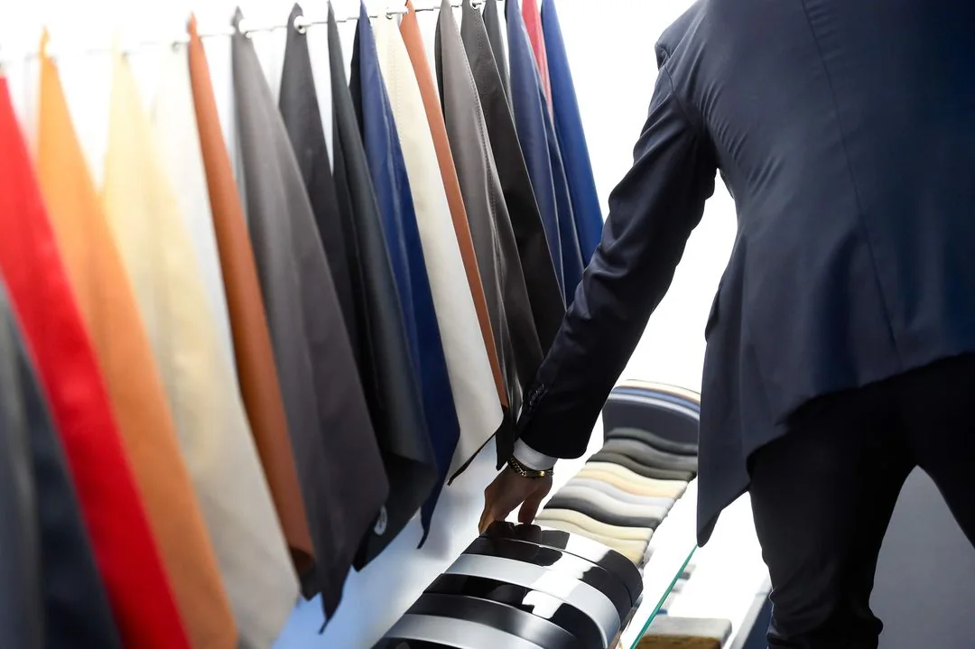 A visitor explores upholstery as part of the wider brand encounter.