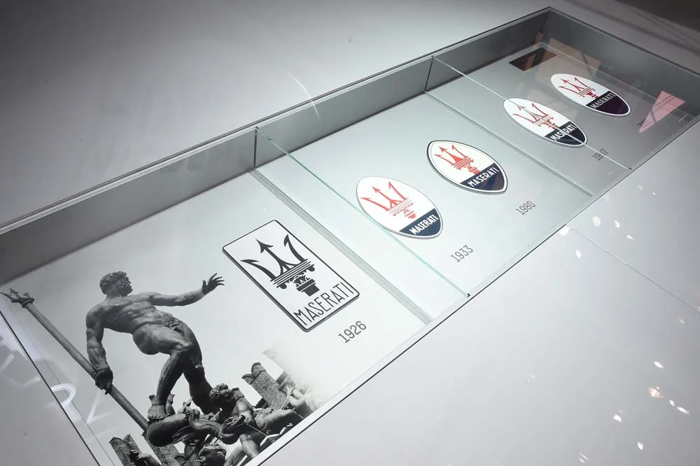Display details connect the marque’s history with the objects in the room.