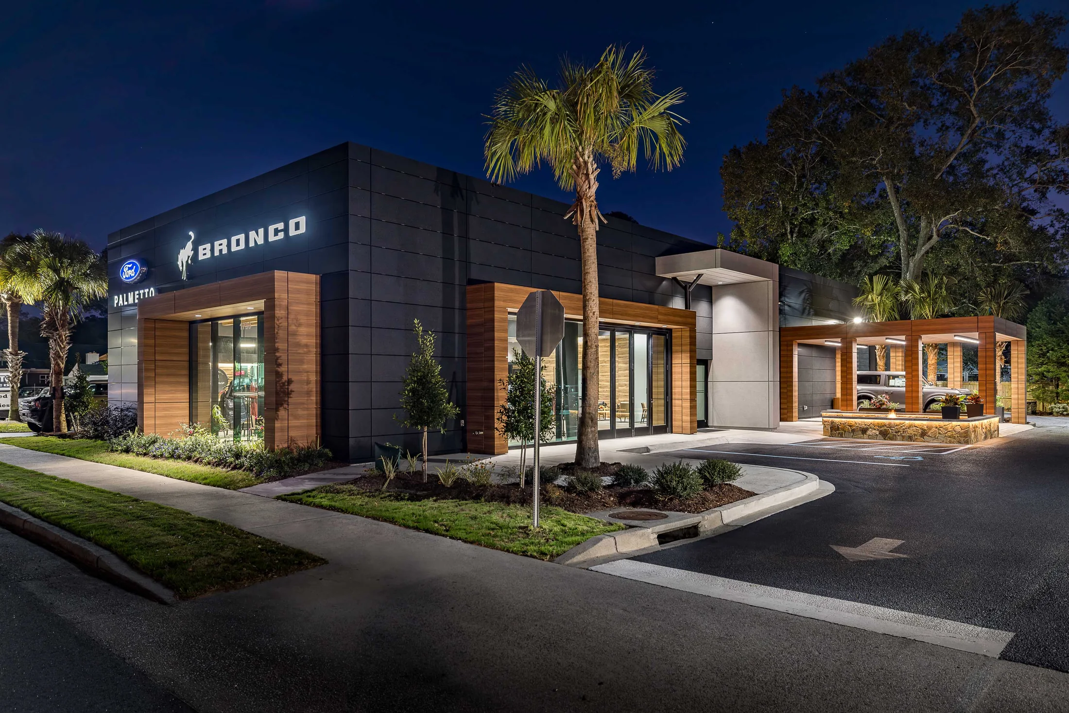 The illuminated exterior extends the facility’s presence into the evening.