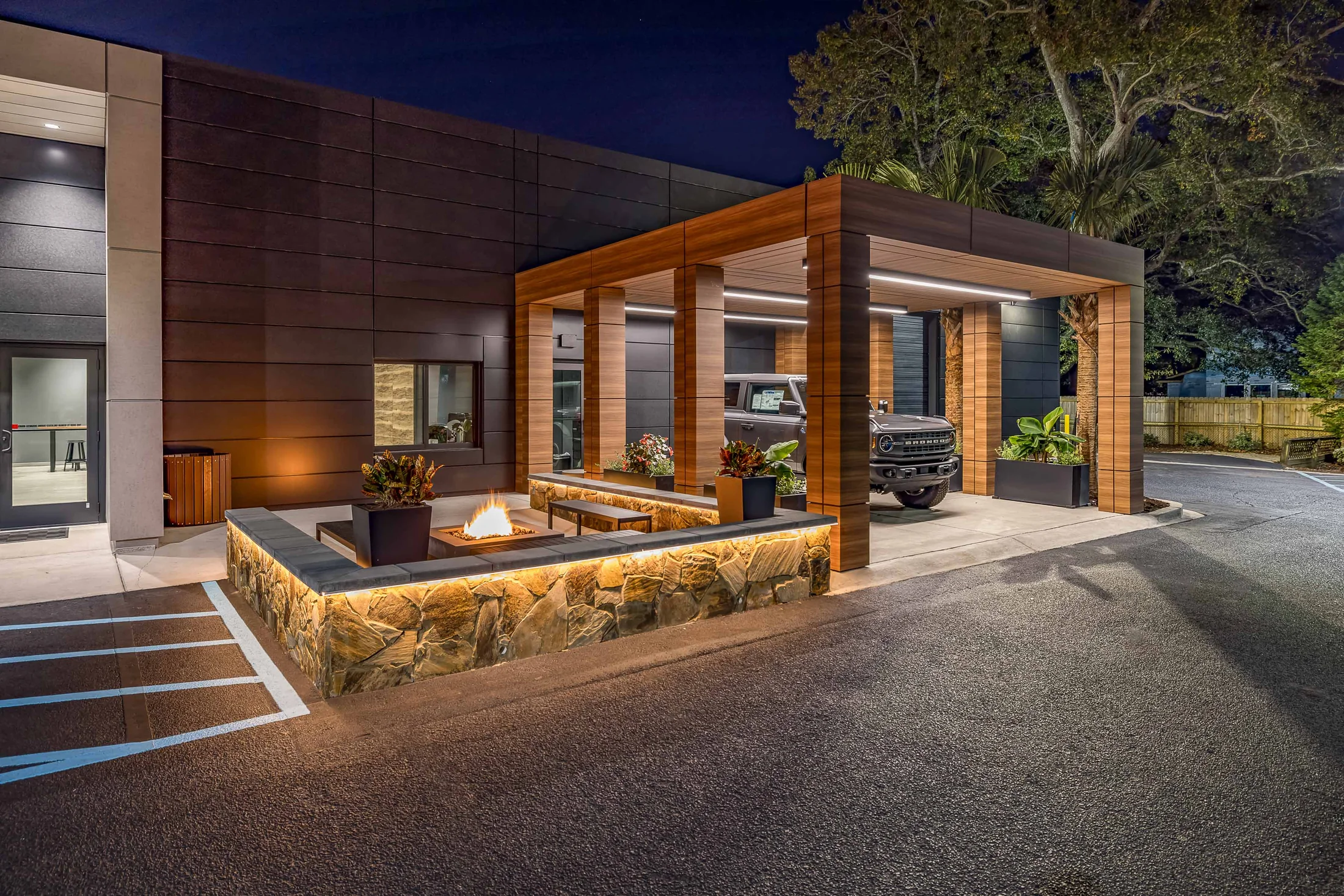 Timber and outdoor seating make the arrival a place to stay.
