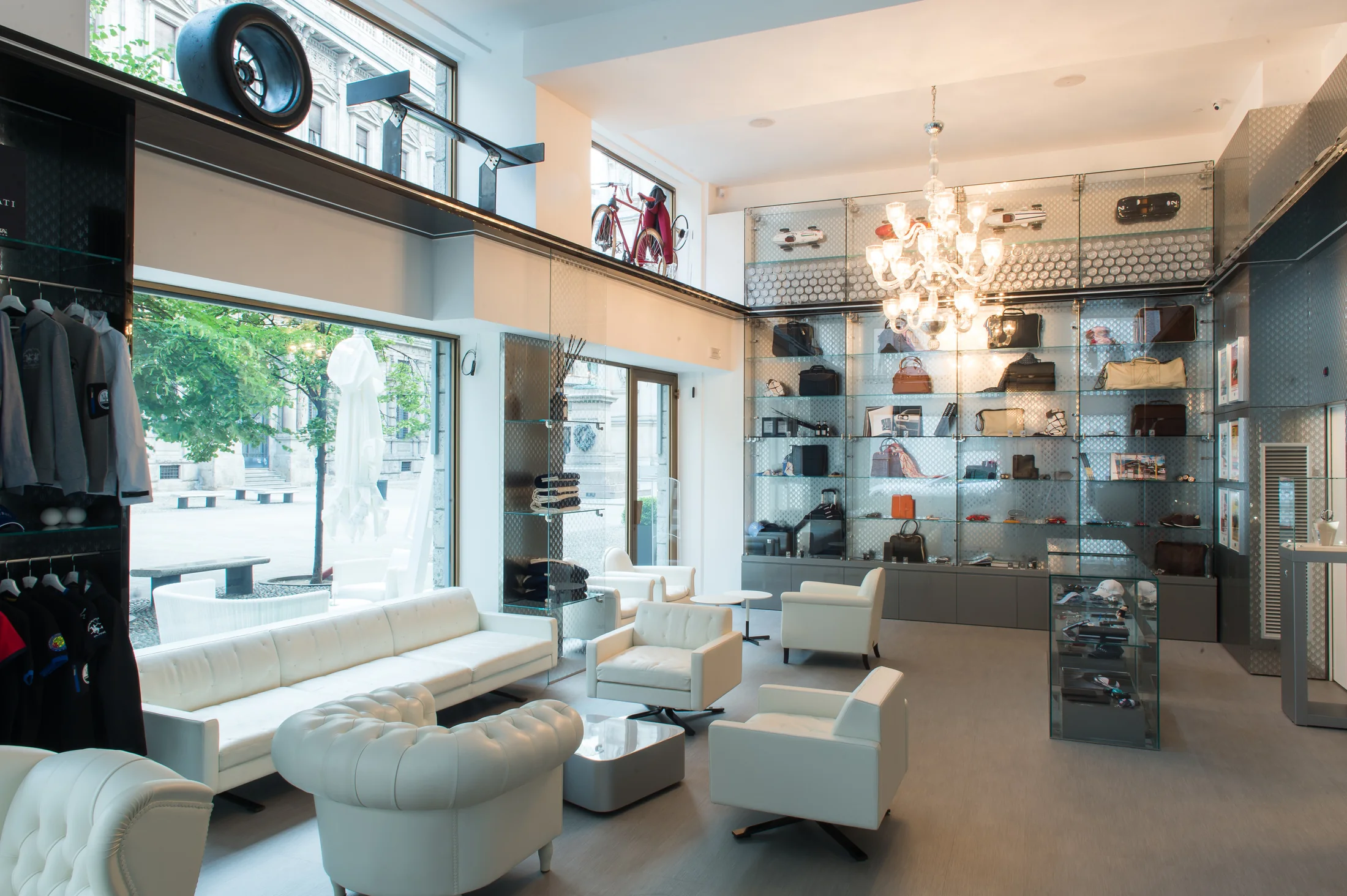 Day / Natural light reveals the material ribbon, lounge and retail displays.