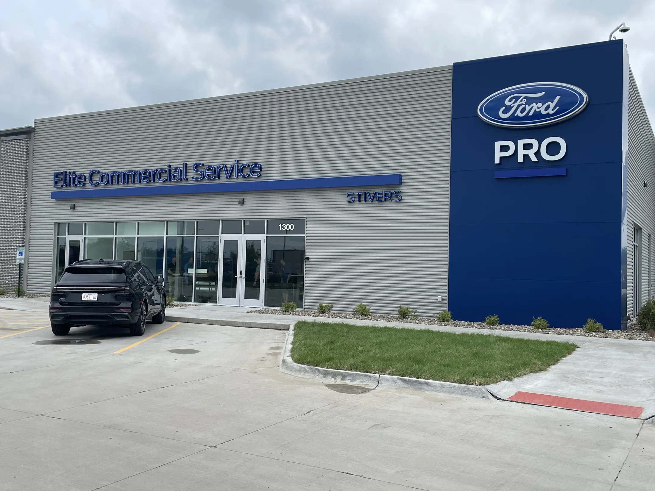 Customer arrival / The Ford Pro identity gives the service facility a clear address.