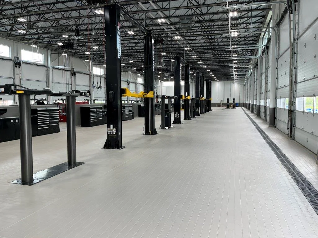 The service floor’s equipment and circulation support the working day.