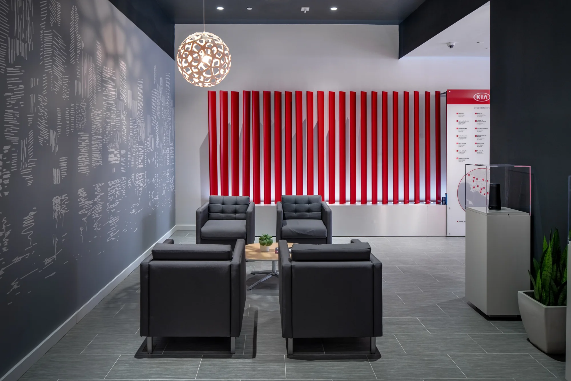 Warm seating and sculptural lighting bring another scale to the salon.