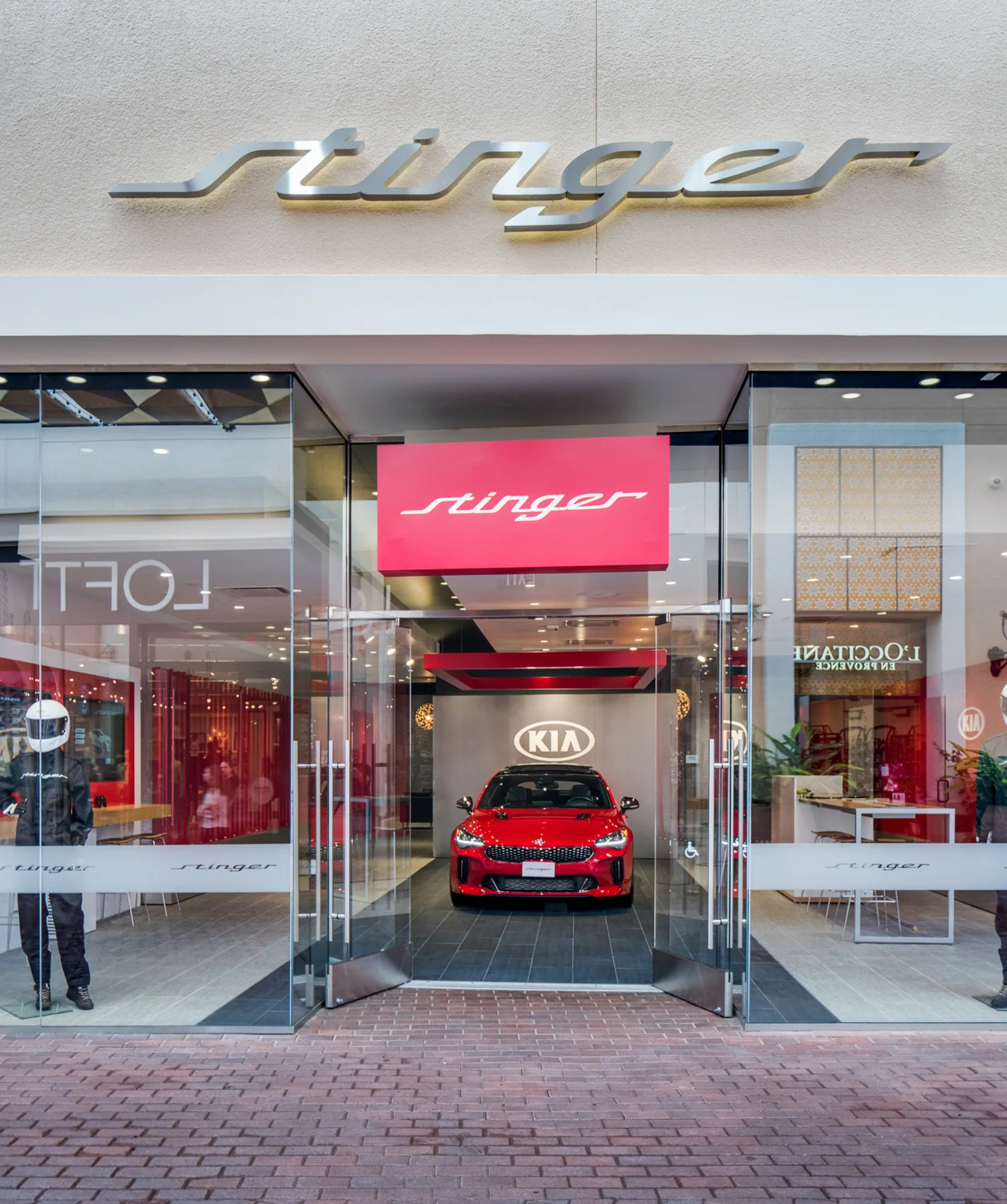 The Stinger Salon opens onto the everyday life of the shopping destination.