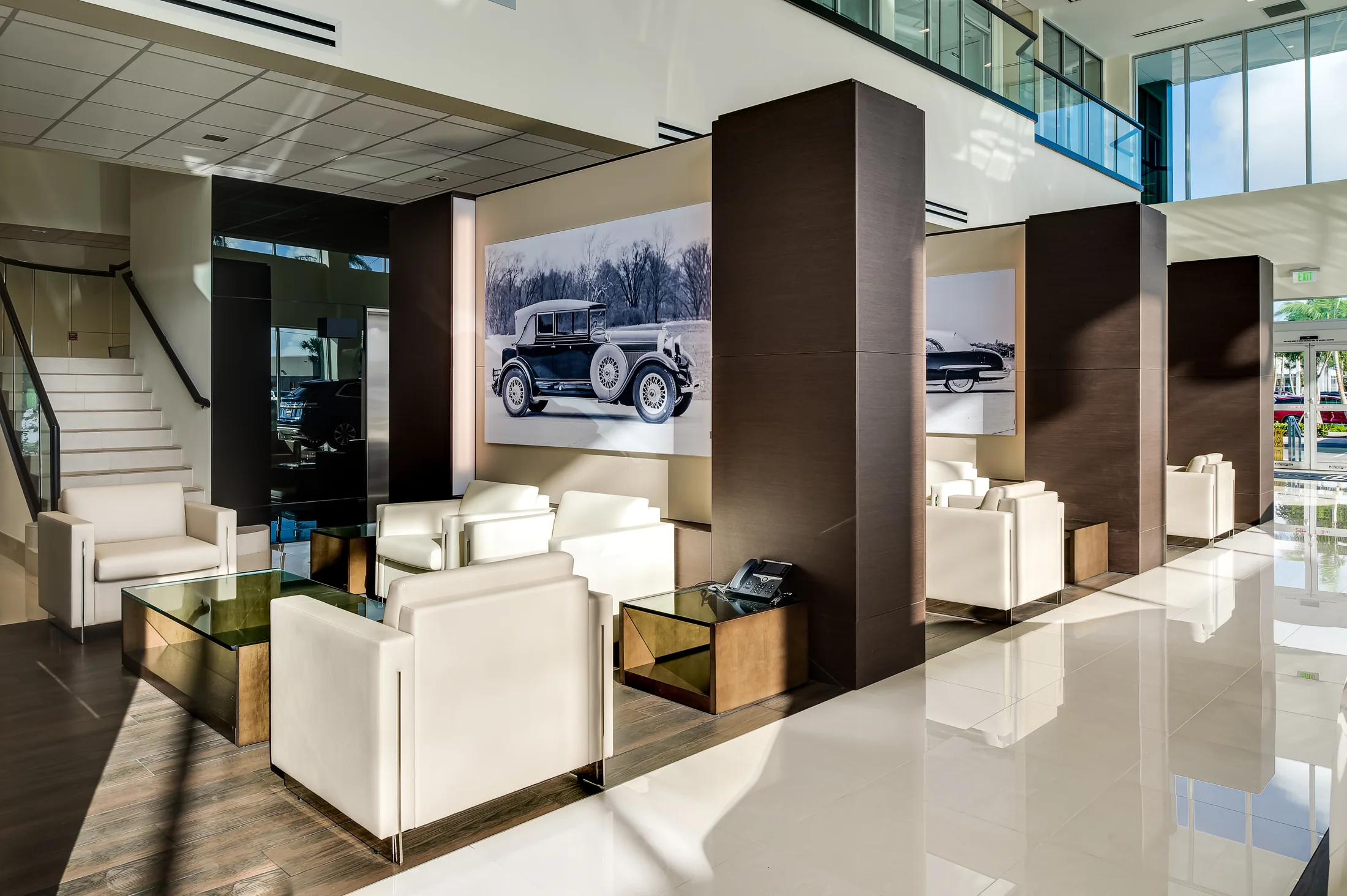Material planes define smaller settings within the open showroom.