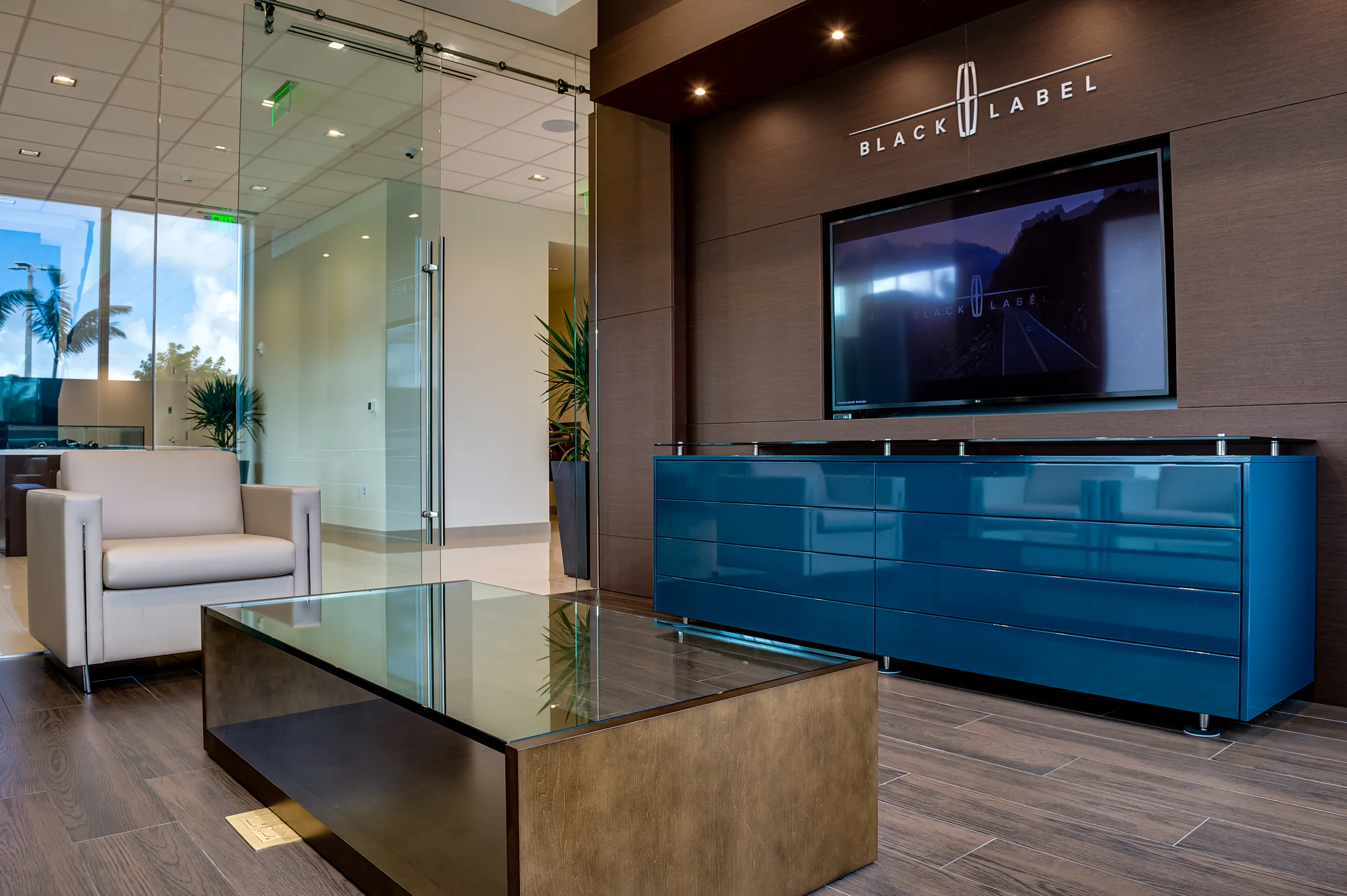 Media and cabinetry are integrated into the hospitality setting.