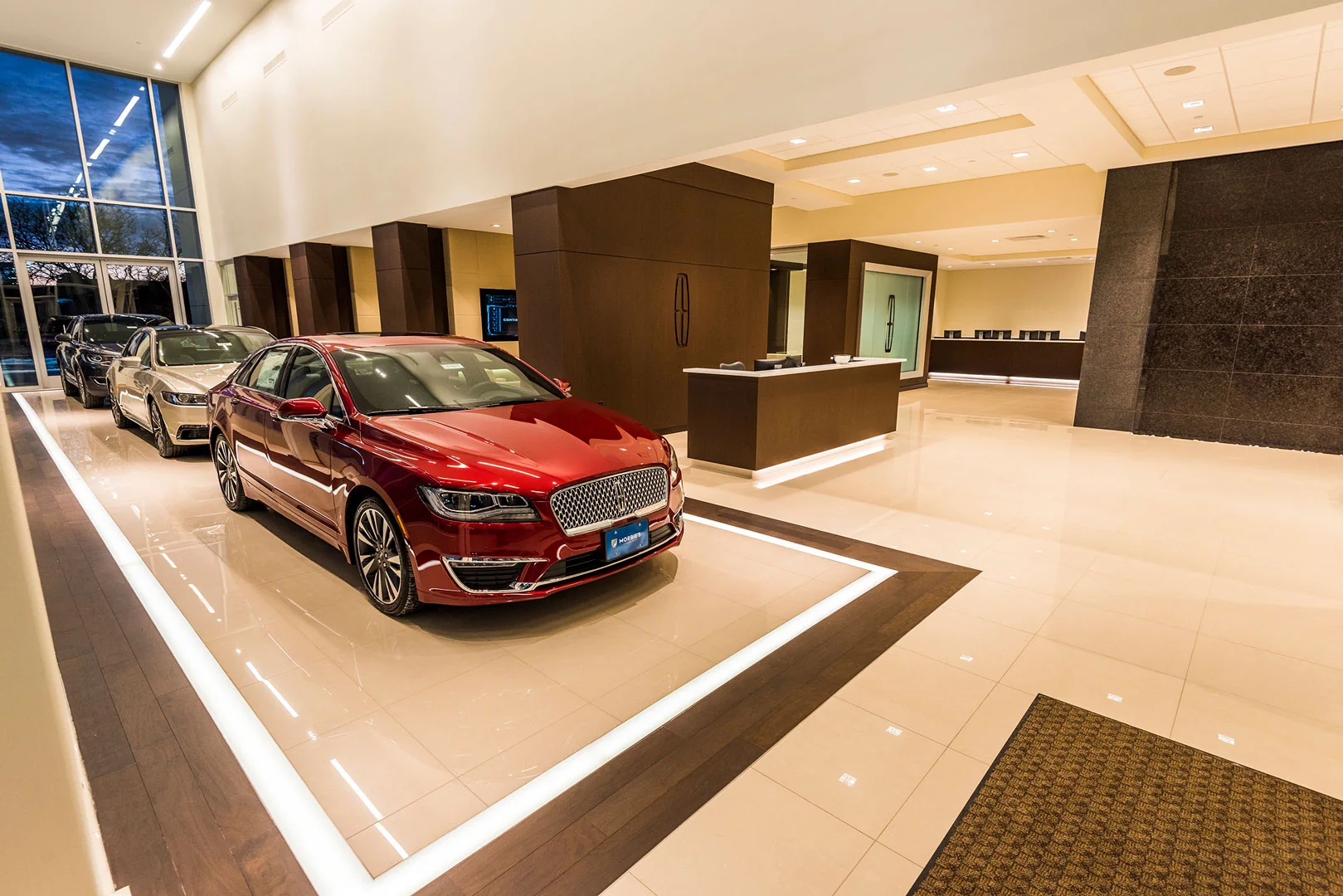 The showroom places the vehicle at the center of a carefully framed view.