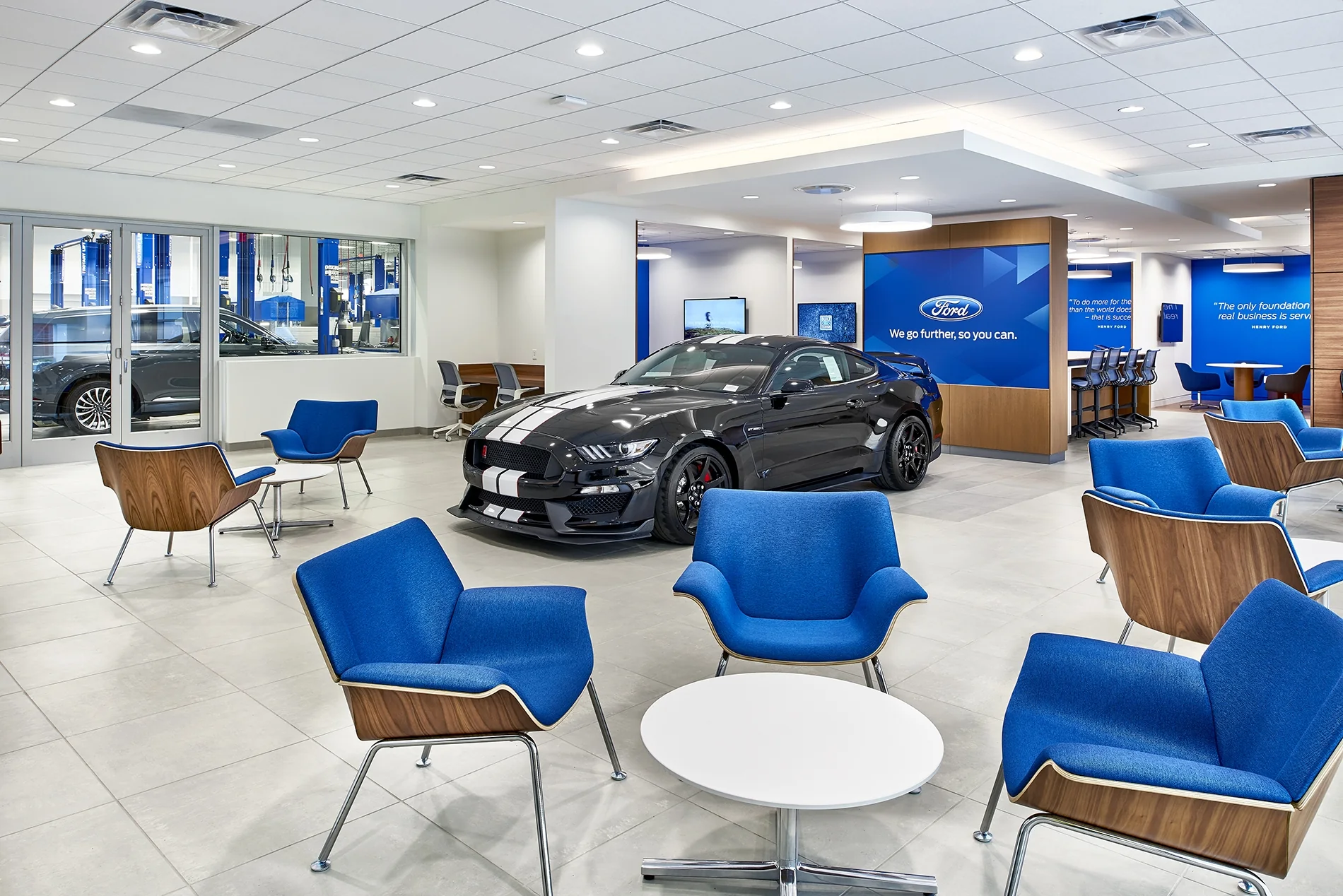 Showroom seating makes room for a pause alongside the vehicle display.
