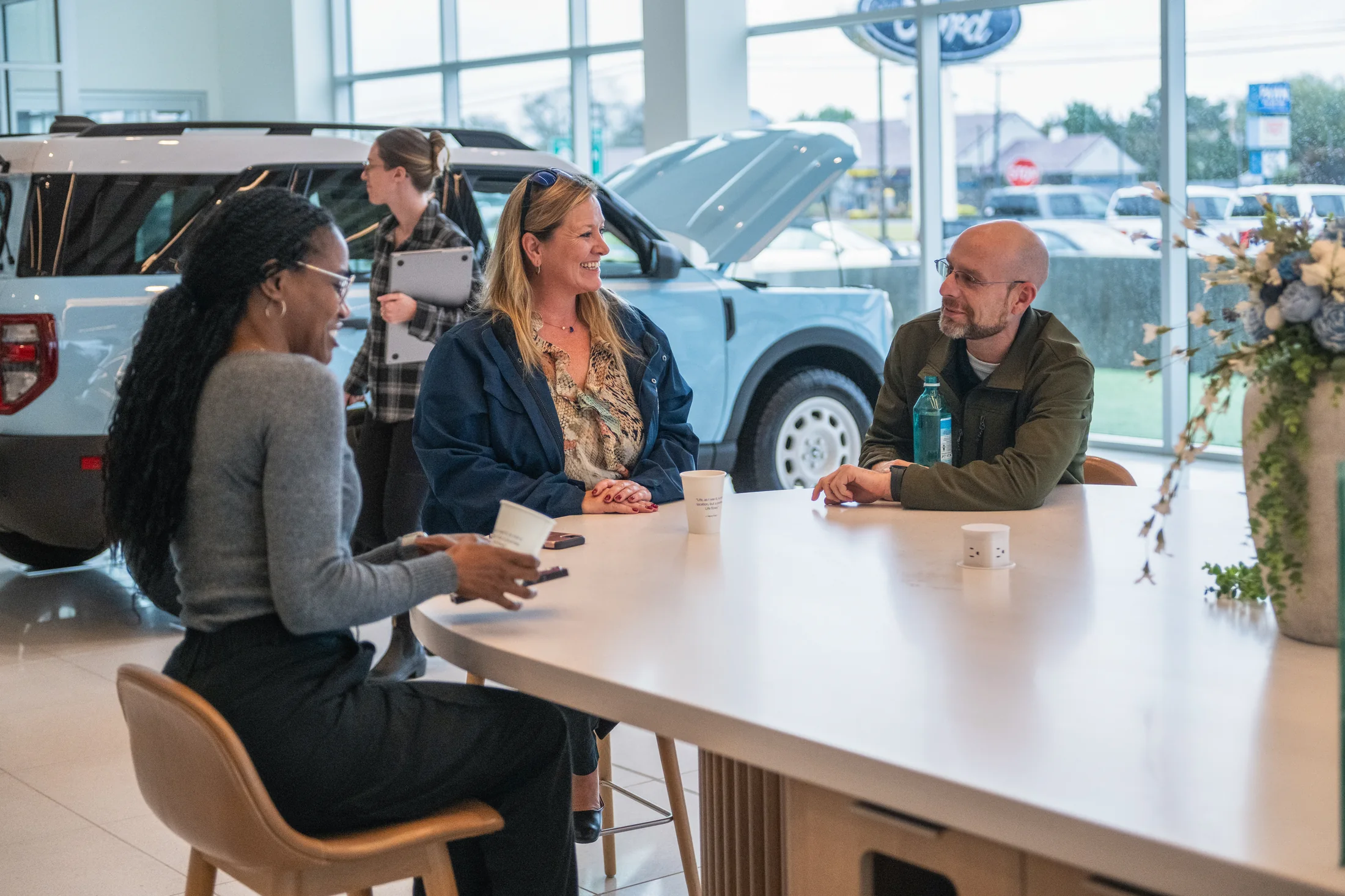 A shared table makes room for the dealer and customer to work through the choices.