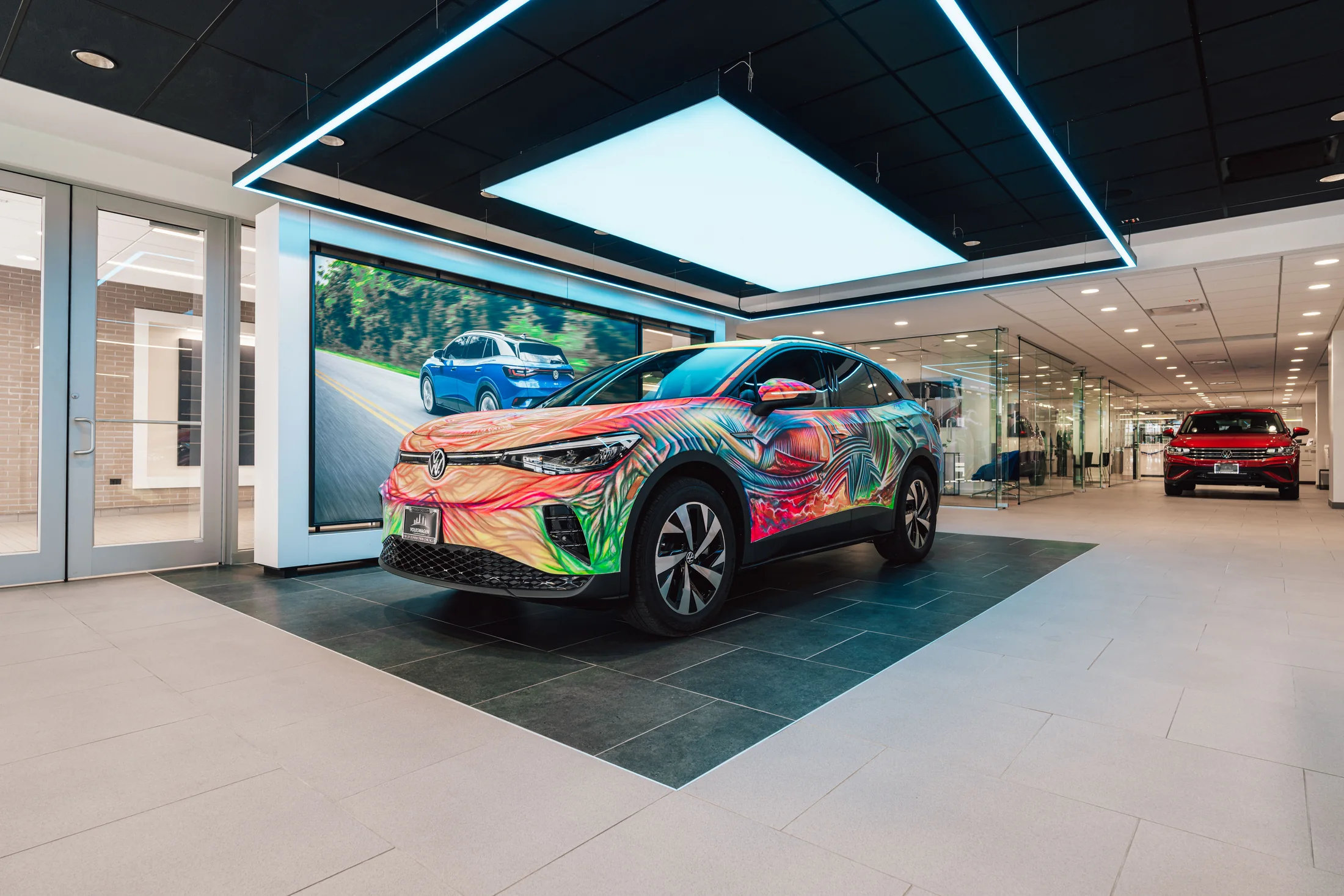 Vehicle presentation brings the brand’s color into the customer setting.