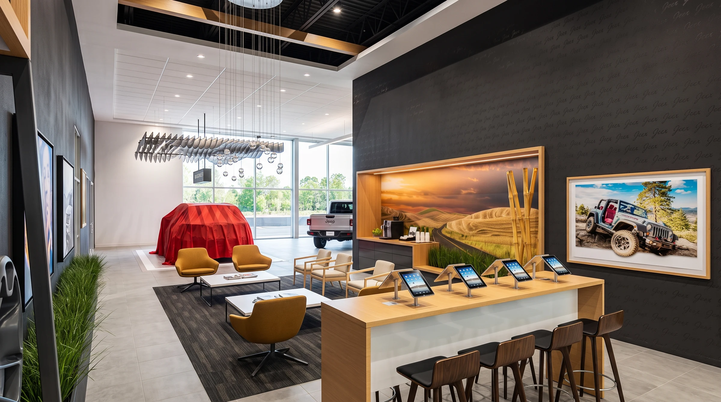 The lounge connects hospitality, retail displays and vehicle presentation.