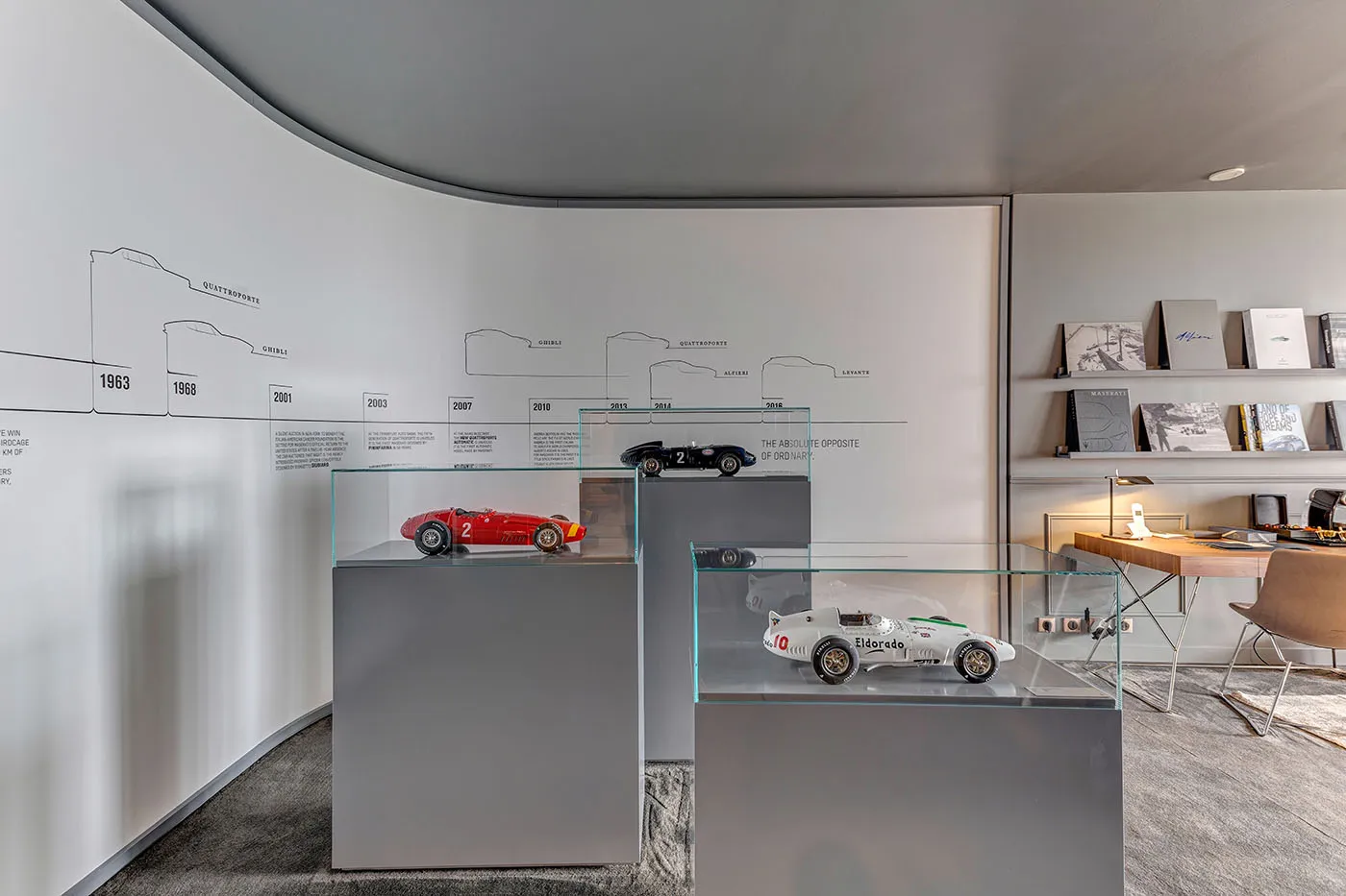 A curated selection of objects connects the room with the marque.